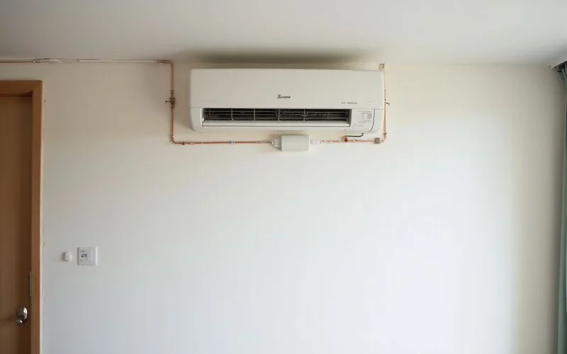 Completed aircond installation with clean worksite and new wall-mounted unit operating perfectly in a modern Subang Jaya apartment